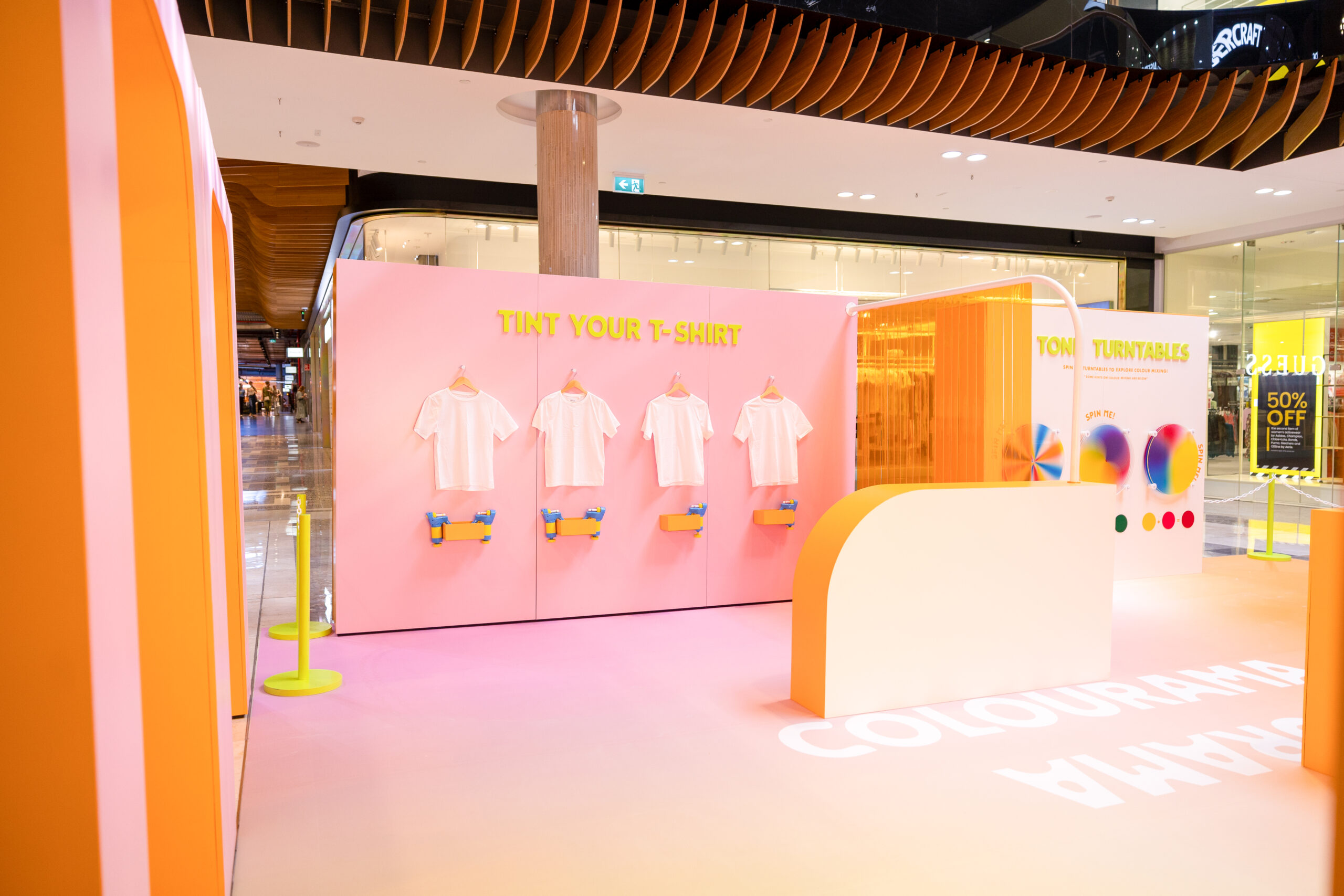 Angled View of the Pink and Orange Interactive set with the Colouring Shirts and Colour Wheel on Display.