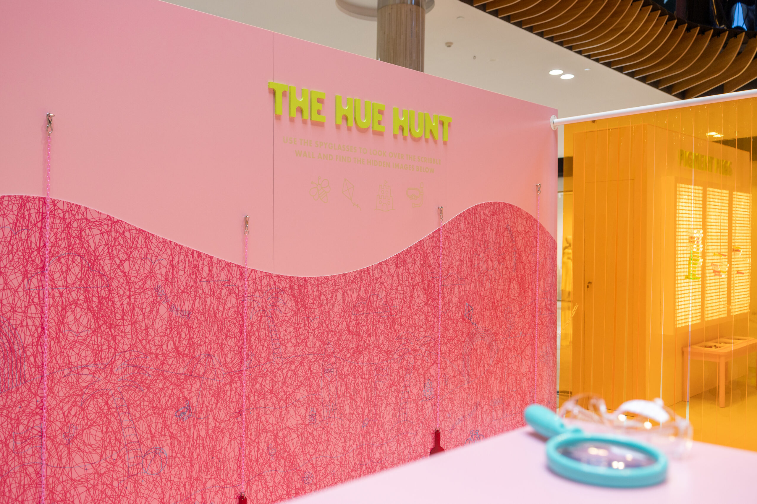 Pink Interactive Discovery Wall with Hidden Drawings for Kids.