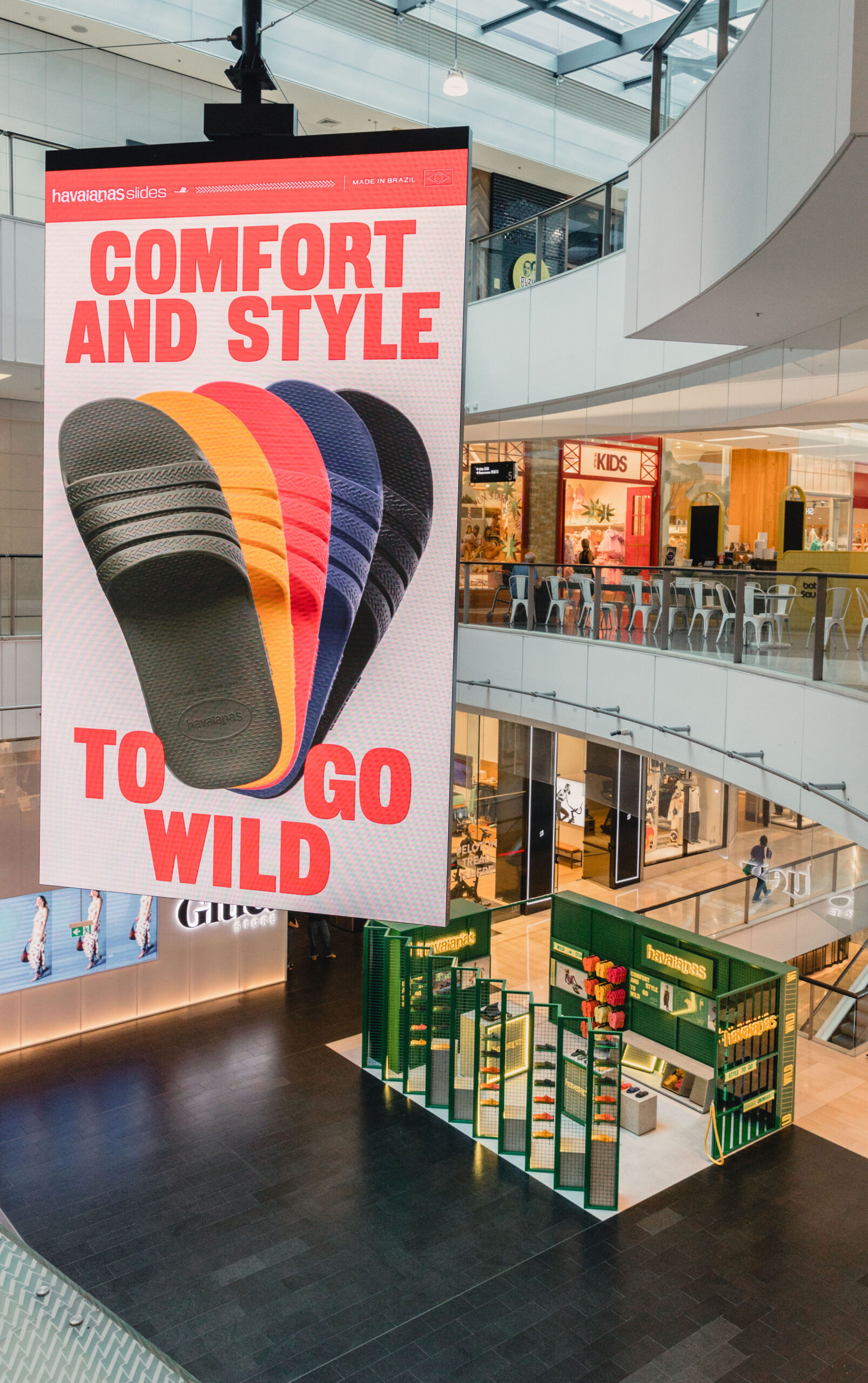 Birds Eye View of Havaianas Pop-up set with Large Digital Display Hung from Ceiling of Westfield Bondi Junction.