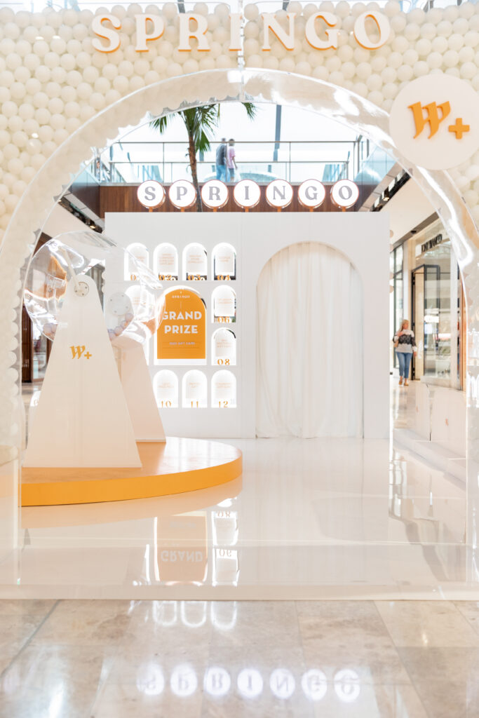 White Glossy Springo set with an Arched entry and Orange Detailing.